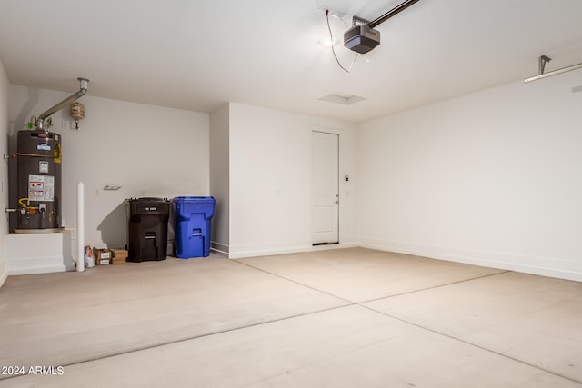 garage with a garage door opener and gas water heater