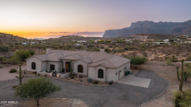 9864 E Baseline Ave, Gold Canyon, AZ 85118 - mediterranean / spanish home with a chimney, driveway, a mountain view, and an attached garage