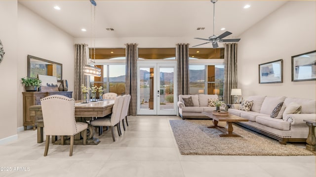 9864 E Baseline Ave, Gold Canyon, AZ 85118 - living room with healthy amount of natural light, recessed lighting, a ceiling fan, a high ceiling, and french doors