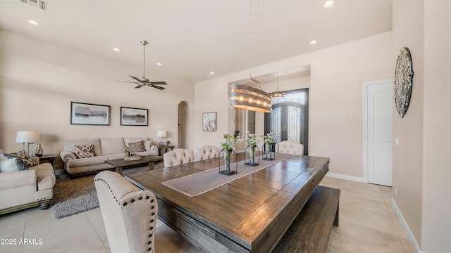 9864 E Baseline Ave, Gold Canyon, AZ 85118 - dining area featuring arched walkways, light tile patterned flooring, recessed lighting, and ceiling fan