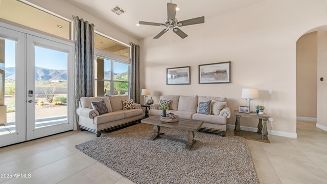 9864 E Baseline Ave, Gold Canyon, AZ 85118 - living area featuring arched walkways, light tile patterned floors, and ceiling fan
