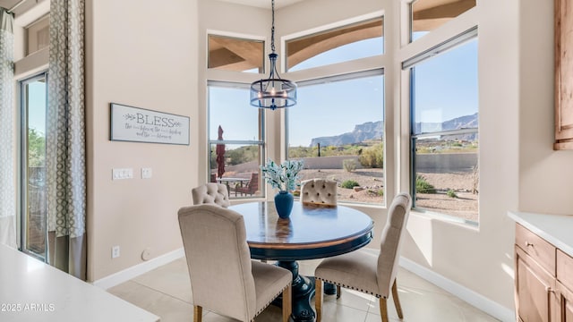 9864 E Baseline Ave, Gold Canyon, AZ 85118 - dining room with a mountain view, a chandelier, and light tile patterned floors