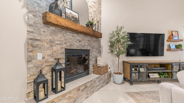9864 E Baseline Ave, Gold Canyon, AZ 85118 - tiled living room with a glass covered fireplace
