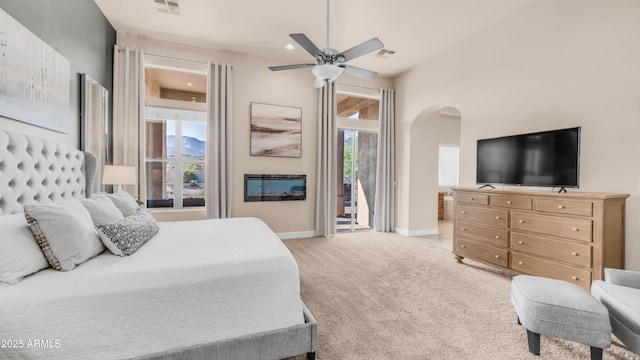 9864 E Baseline Ave, Gold Canyon, AZ 85118 - bedroom with arched walkways, light colored carpet, access to outside, recessed lighting, and ceiling fan