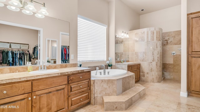 9864 E Baseline Ave, Gold Canyon, AZ 85118 - full bath featuring a garden tub, vanity, a walk in shower, a walk in closet, and tile patterned floors
