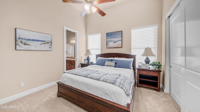 9864 E Baseline Ave, Gold Canyon, AZ 85118 - bedroom featuring light colored carpet, a closet, ceiling fan, high vaulted ceiling, and ensuite bath