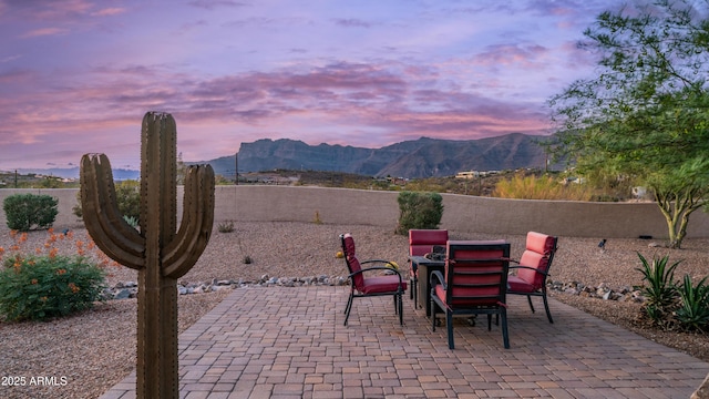 9864 E Baseline Ave, Gold Canyon, AZ 85118 - patio terrace at dusk with a patio area and a mountain view
