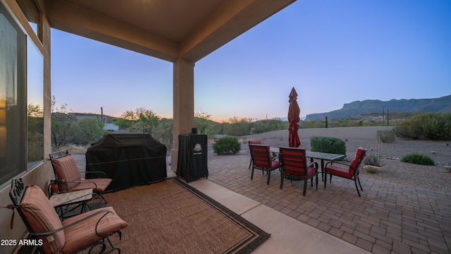 9864 E Baseline Ave, Gold Canyon, AZ 85118 - view of patio featuring outdoor dining area, a grill, and a mountain view