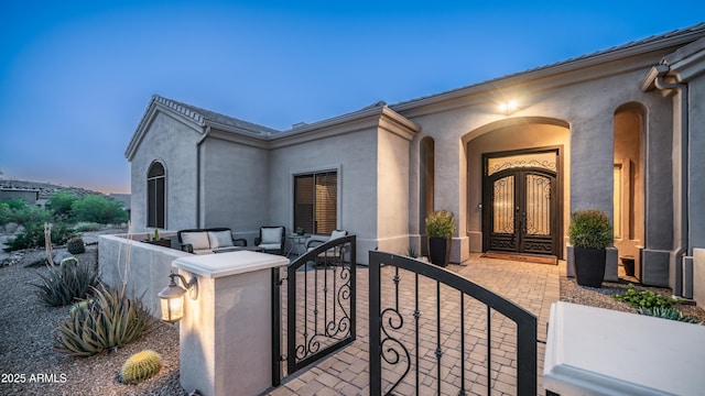 9864 E Baseline Ave, Gold Canyon, AZ 85118 - entrance to property featuring a gate, stucco siding, and french doors