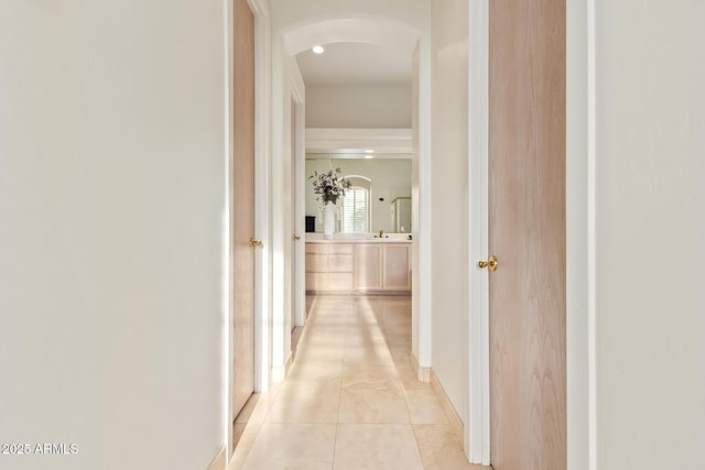 hall featuring light tile patterned floors