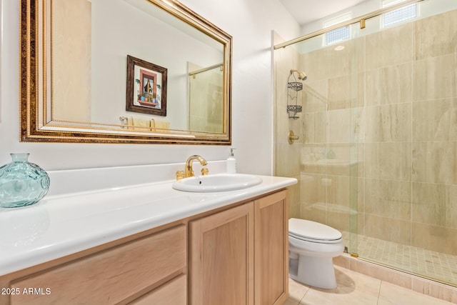 bathroom featuring vanity, toilet, a shower with door, and tile patterned flooring