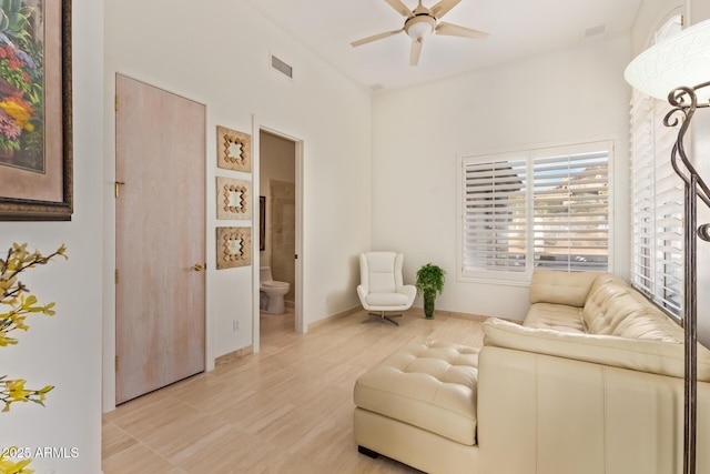 sitting room featuring ceiling fan