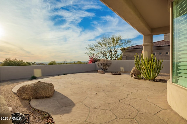 view of patio terrace at dusk