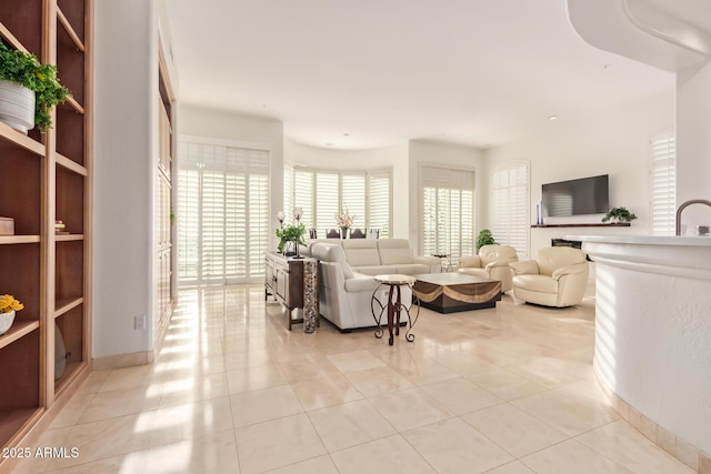 tiled living room featuring sink