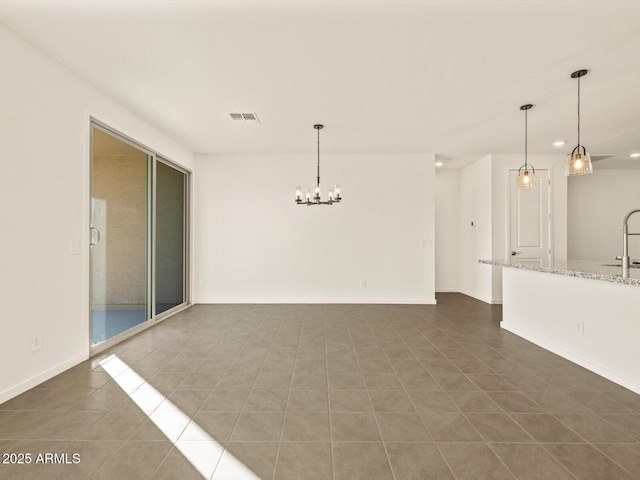 spare room with dark tile patterned flooring