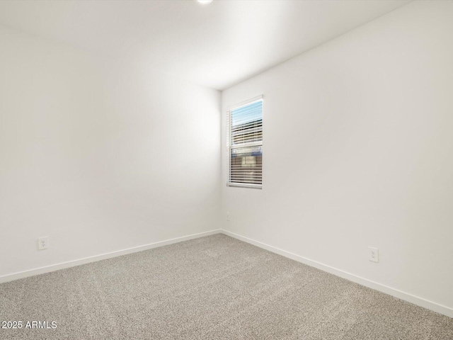 spare room featuring carpet flooring