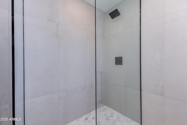 bathroom with a tile shower