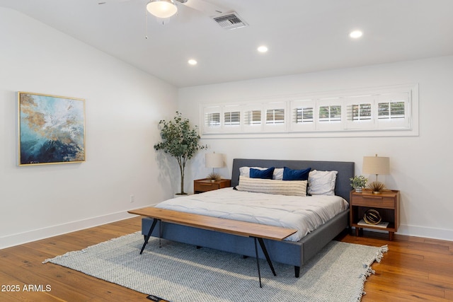 3817 E Highland Ave, Phoenix, AZ 85018 - bedroom featuring wood finished floors, recessed lighting, baseboards, multiple windows, and lofted ceiling