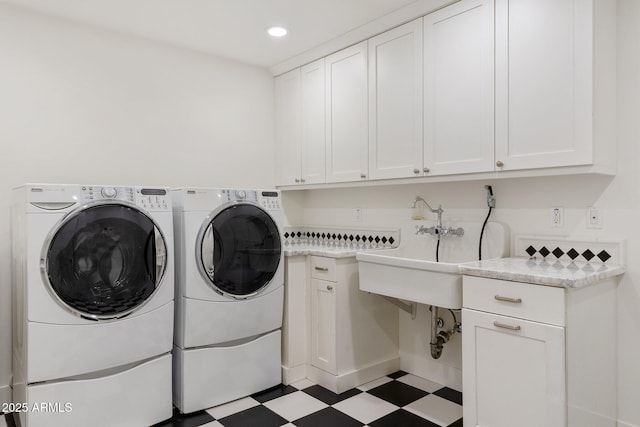 3817 E Highland Ave, Phoenix, AZ 85018 - laundry room featuring tile patterned floors, cabinet space, washer and dryer, and recessed lighting