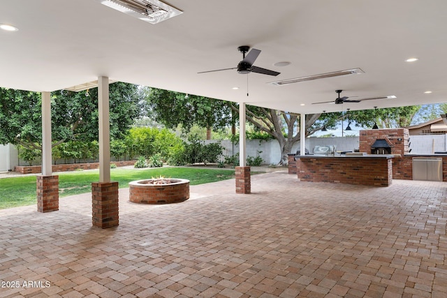 3817 E Highland Ave, Phoenix, AZ 85018 - view of patio featuring exterior kitchen, a fire pit, and ceiling fan