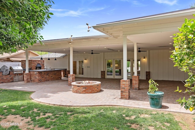 3817 E Highland Ave, Phoenix, AZ 85018 - view of patio with french doors, a ceiling fan, and a fire pit