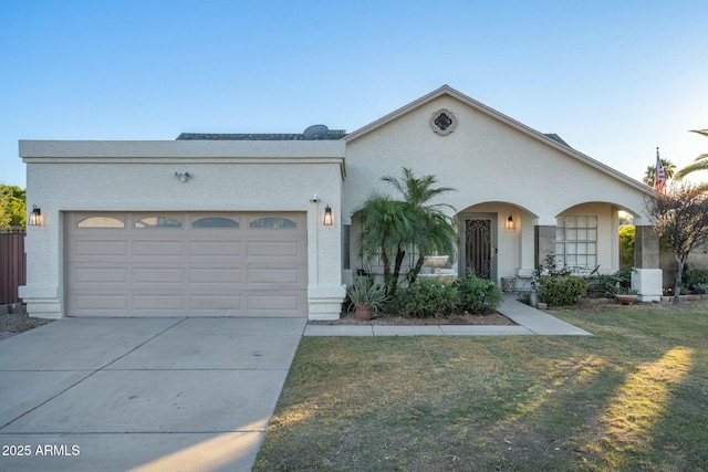 view of front facade featuring a front yard and a garage