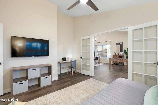 bedroom with ceiling fan, dark hardwood / wood-style flooring, and french doors