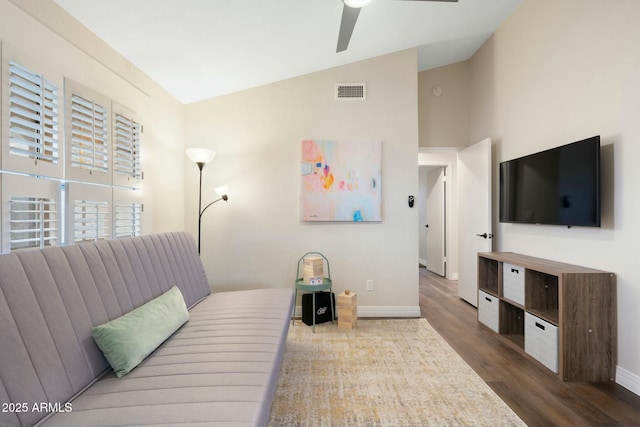 bedroom with hardwood / wood-style floors, ceiling fan, and lofted ceiling