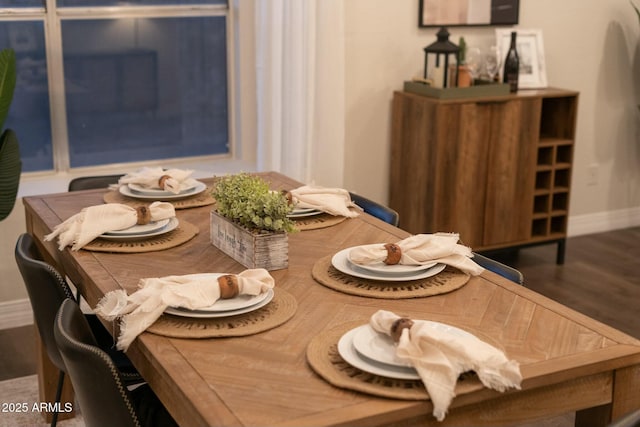 dining room with wood-type flooring