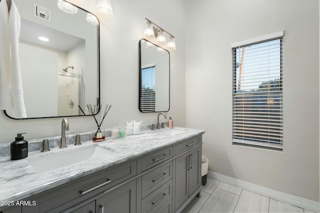 bathroom featuring vanity, tile patterned floors, and an enclosed shower