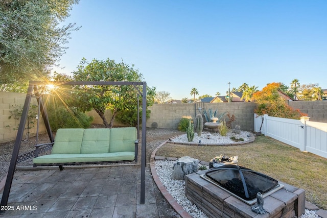 view of patio / terrace featuring an outdoor fire pit