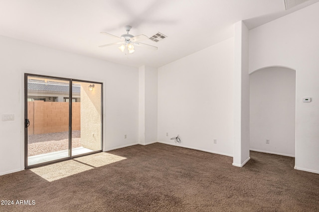 carpeted empty room featuring ceiling fan