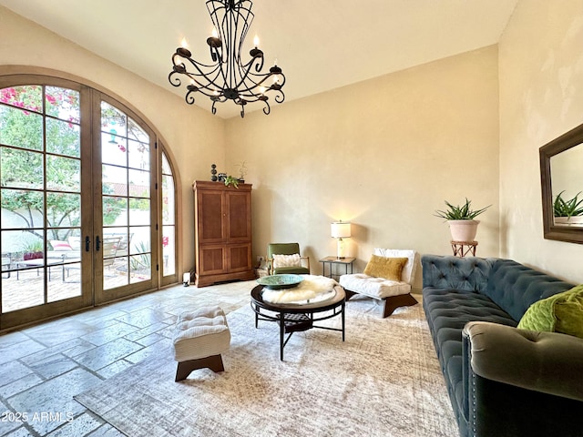 sitting room featuring french doors and a chandelier