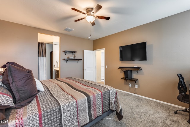 bedroom with ceiling fan, connected bathroom, and carpet