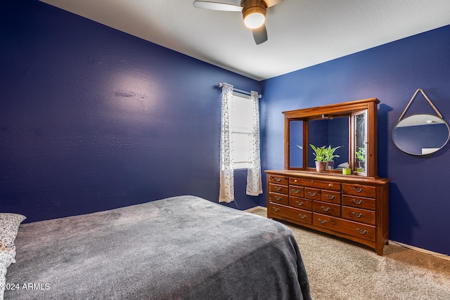 carpeted bedroom with ceiling fan