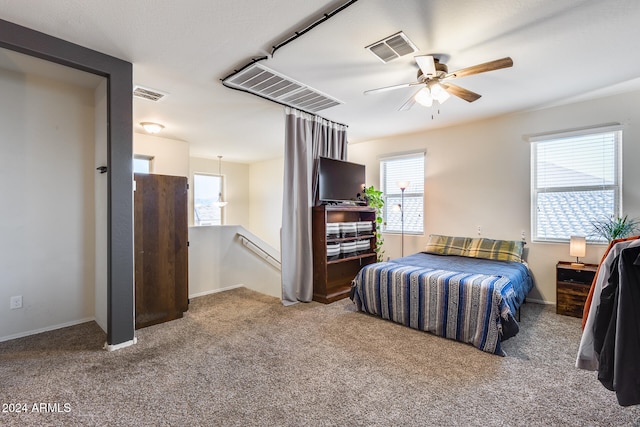 bedroom with ceiling fan and carpet flooring