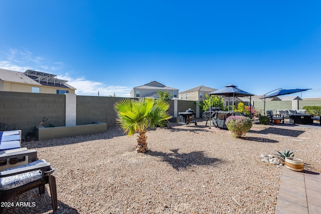 view of yard featuring a patio area and a gazebo