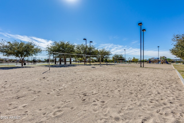 view of community featuring volleyball court and a playground