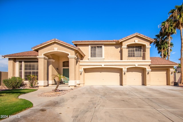 mediterranean / spanish-style home featuring a garage