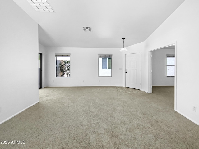 40168 W Sanders Way, Maricopa, AZ 85138 - unfurnished room with carpet floors, vaulted ceiling, healthy amount of natural light, and baseboards
