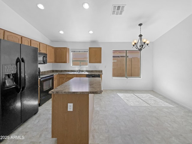 40168 W Sanders Way, Maricopa, AZ 85138 - kitchen with black appliances, a sink, lofted ceiling, a chandelier, and a kitchen island