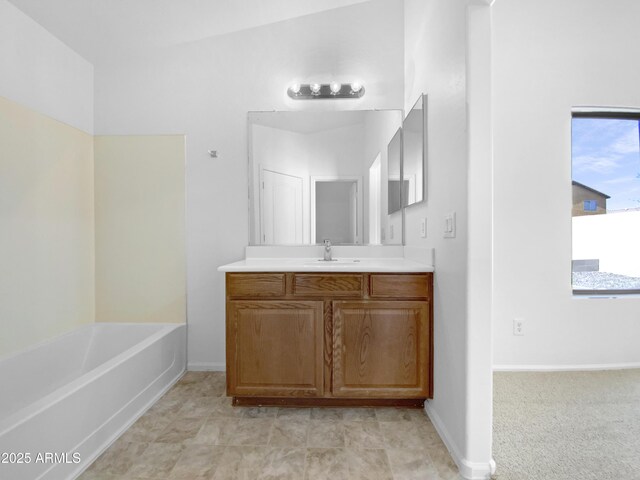 40168 W Sanders Way, Maricopa, AZ 85138 - full bath featuring vanity, a tub to relax in, and baseboards