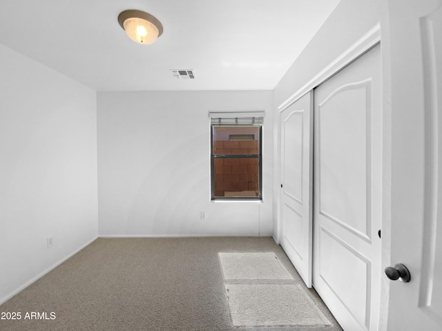40168 W Sanders Way, Maricopa, AZ 85138 - unfurnished bedroom featuring carpet, a closet, and baseboards