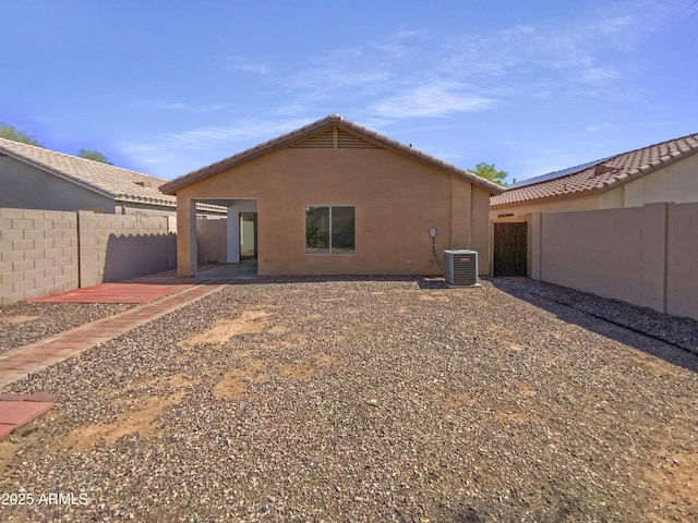 40168 W Sanders Way, Maricopa, AZ 85138 - back of property featuring a fenced backyard, stucco siding, a tile roof, and central air condition unit
