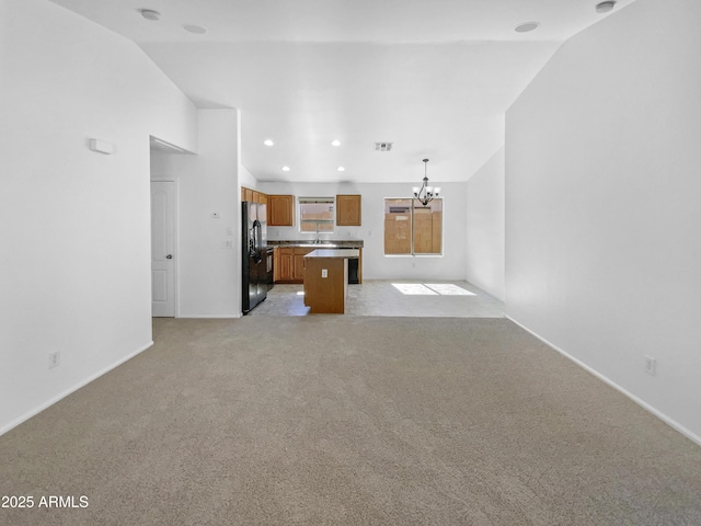 40168 W Sanders Way, Maricopa, AZ 85138 - unfurnished living room featuring a chandelier, vaulted ceiling, light carpet, baseboards, and recessed lighting