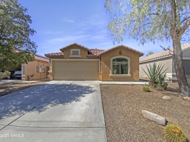 40168 W Sanders Way, Maricopa, AZ 85138 - mediterranean / spanish-style house with stucco siding, a tiled roof, driveway, and a garage