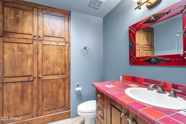 9980 E Charter Oak Rd, Scottsdale, AZ 85260 - bathroom with vanity and toilet