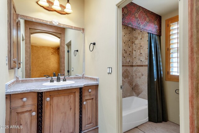 9980 E Charter Oak Rd, Scottsdale, AZ 85260 - bathroom featuring vanity and shower / bathtub combination with curtain