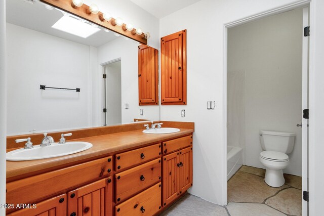 9980 E Charter Oak Rd, Scottsdale, AZ 85260 - bathroom featuring vanity, toilet, and tile patterned flooring