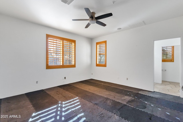 9980 E Charter Oak Rd, Scottsdale, AZ 85260 - spare room featuring ceiling fan